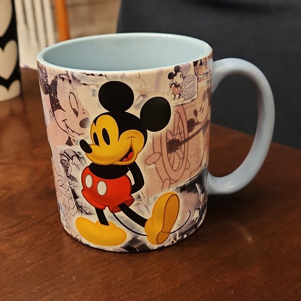 Disney Parks Mickey Mouse Newspaper Art Collage Through the Years Blue Mug
